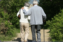 Two elderly people walking